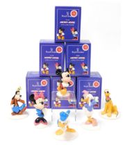 Six Royal Doulton The Mickey Mouse Collection figures, comprising Pluto, Goofy, Daisy Duck, Mickey M