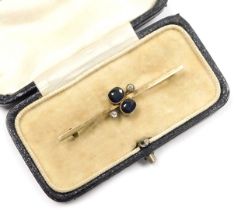 An Edwardian sapphire and diamond set bar brooch, in yellow metal, boxed, 2.2g.