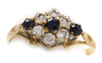 A 9ct gold cluster ring, the central cluster set with blue and white paste stones formed as a flower