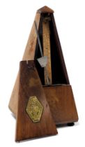 A Maelzel Paquet oak cased metronome, 22cm high.