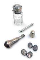 A Victorian cut glass and silver mounted smelling salts bottle, with an embossed floral hinged lid,