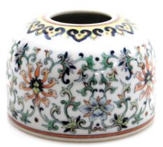 A Chinese doucai porcelain brush pot in 18thC style, decorated in coloured enamels, bearing six char