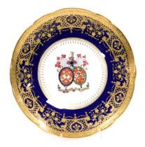 A Minton armorial cabinet plate, with marriage armorial to the centre bearing Latin motto nec diu ne