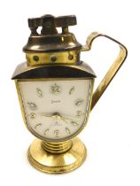 A mid 20thC Swiza brass cased novelty bedside clock, with integral cigarette lighter, shield shaped