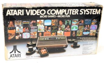 An Atari video computer system, model CX-2600A, boxed.