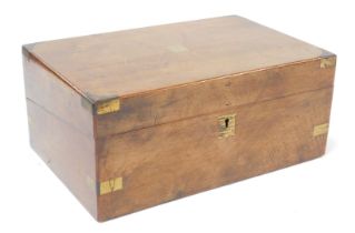 A Victorian walnut and brass mounted writing box, the top with a vacant brass cartouche, the hinged