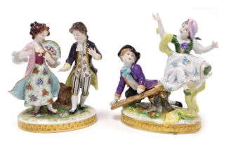 Two 20thC Volkstedt porcelain figure groups, one modelled with a boy and girl on a see-saw, raised o