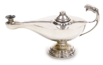 An Eastern silver plated Aladdin's lamp oil lamp, with dragon mask handle on staggered base, 6cm hig