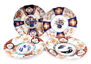 Four Japanese Imari dishes, of fluted form, decorated with reserves of flowers, Meiji period, 21/22c