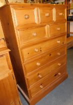 A pine chest, of three short drawers over two short drawers, over four long drawers, raised on a pli