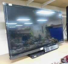 A Bush 32 inch combi DVD television, model no. DLED32265HDDVDBXY, with remote.