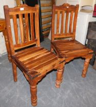 Two wooden chairs, with slatted bases and turned legs.