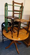 A circular pine kitchen table, a chair with rush seat, small occasional table, towel rail and two me