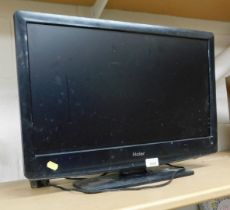 A Haier 24 inch flat screen television, model no. LTF24C360.