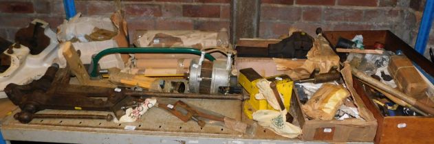 Tools, including a bench vice, alternator, large vice, another vice, various fittings and fixtures.