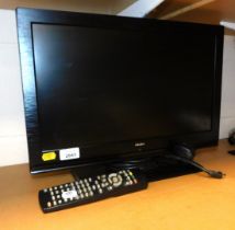 A Bush 19 inch flat screen television, model no. LED19134HD, with remote.