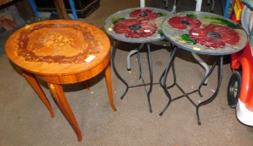 Two garden tables decorated with poppies, and an Italian musical sewing table.