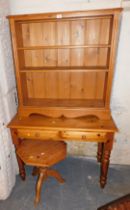 A pine bookcase of three shelves, hall table of two drawers and a small octagonal topped occasional