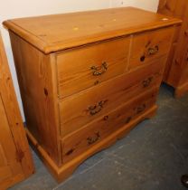 A pine chest of two short over two long drawers, raised on bracket feet.