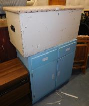 An ottoman and blue painted chest of two short drawers over two panelled doors.