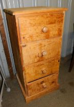 A pine chest of four drawers.