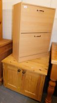 A shoe box, a small pine two door unit.