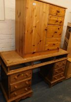 A small pine unit, with door to left hand side and four drawers to right, and a pine kneehole desk,