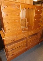 A pine dressing table, of eight drawers raised on plinth base and a pine dressing unit of two drawer