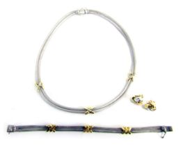 A jewellery suite, comprising two strand necklace and bracelet, in white metal with yellow metal cro