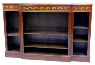 A 20thC Adam style mahogany breakfront open bookcase, the top with a moulded edge above inlaid bows