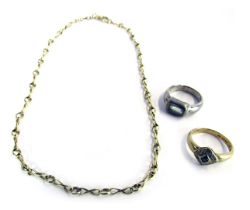 Three items of jewellery, comprising a 9ct gold dress ring, the square set panel set with tiny diamo