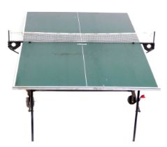 A Kettler folding table tennis table, on a wheeled base, 152cm wide.