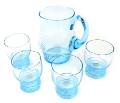 A 20thC blue glass lemonade set, comprising jug with lower ribbed banding to base, 16cm high, and fo