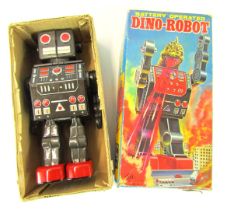 A Japanese Horikawa tin plate battery operated Dino-Robot, with automatic action, in black and red,