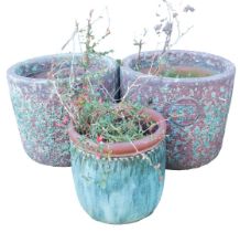 A pair of garden planters, of circular form, in burgundy with reactive blue glaze, each bearing a ro