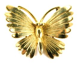 A butterfly brooch, yellow metal stamped 375, 2.5cm wide, 3.4g.