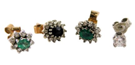 Four single stud earrings, comprising a diamond stud, two emerald and diamond cluster, unmatched, an