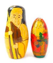 Two Russian Matryoshka nesting dolls, comprising doll depicting Father Christmas, the largest 14cm h