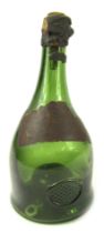 A late 19thC green glass bottle, bearing label for Grande Champagne Reserve 1898 de la Peyrouse, 25c