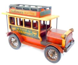 A 20thC wooden model of a vintage double decker bus, sign written for Gallimore Irish Whisky and Cit