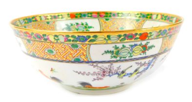 A late 20thC Chinese famille rose porcelain bowl, painted with fruits and flowers border, with cocke