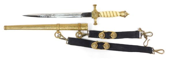 A German Imperial naval dirk, the open crown pommel above an ivorine grip interspersed with twisted