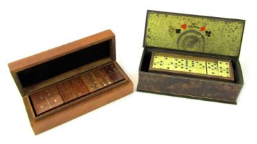 A set of wooden dominoes, contained in a hardwood case, 20cm diameter, together with a tin case cont