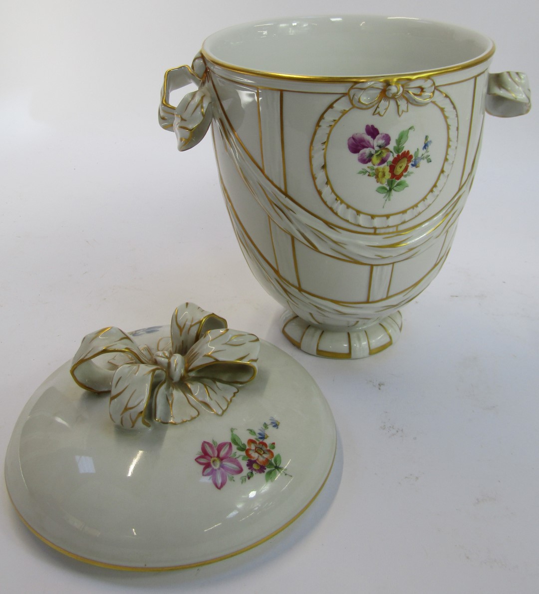 A KPM Berlin porcelain jar and cover, on a cream ground decorated with ribbons, bows and floral spra - Image 3 of 5