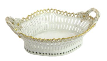 A KPM Berlin porcelain two handled basket, with pierced and moulded decoration, stamped to underside