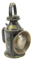 A black painted railway lantern, bearing brass plaque for JT Davies, 29cm high.