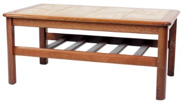 A mid century teak tile top coffee table, with slatted under tier, raised on four curved triangular