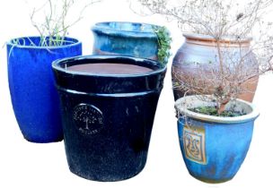 Five garden plant pots, of differing designs, colours and styles, to include a blue glazed example,