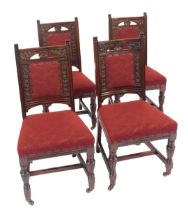 A set of four late Victorian mahogany single dining chairs, each with a carved back with floral moti