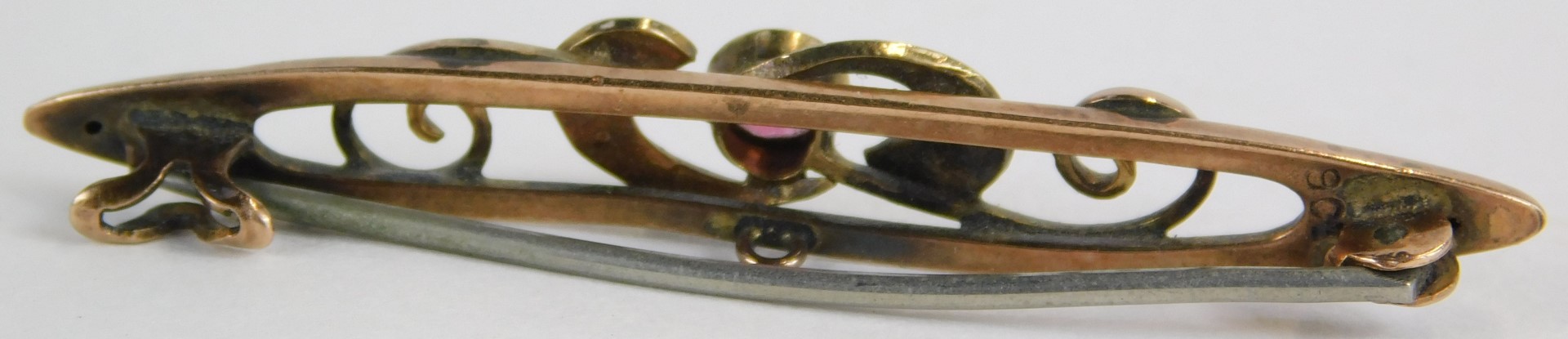 A 9ct gold topaz and seed pearl bar brooch, the central pink topaz flanked by seed pearl set scrolls - Image 2 of 2